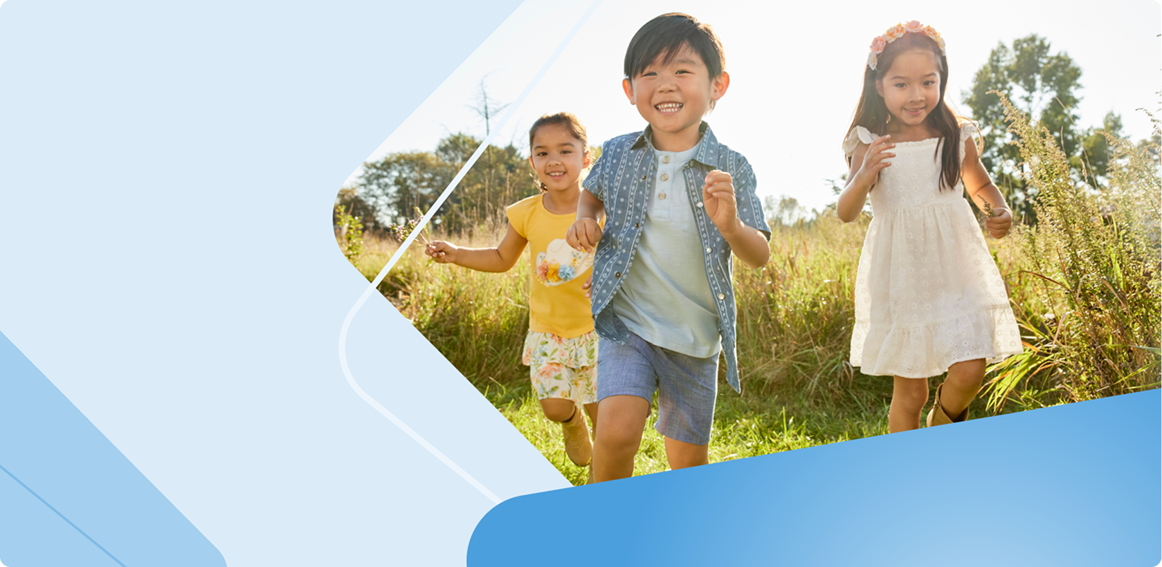 Three children running in a field