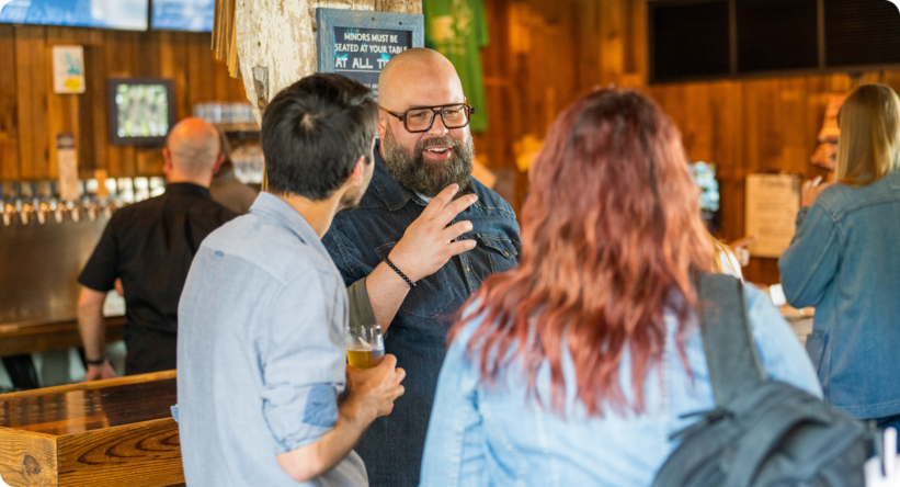 A group of staff members talking in a circle